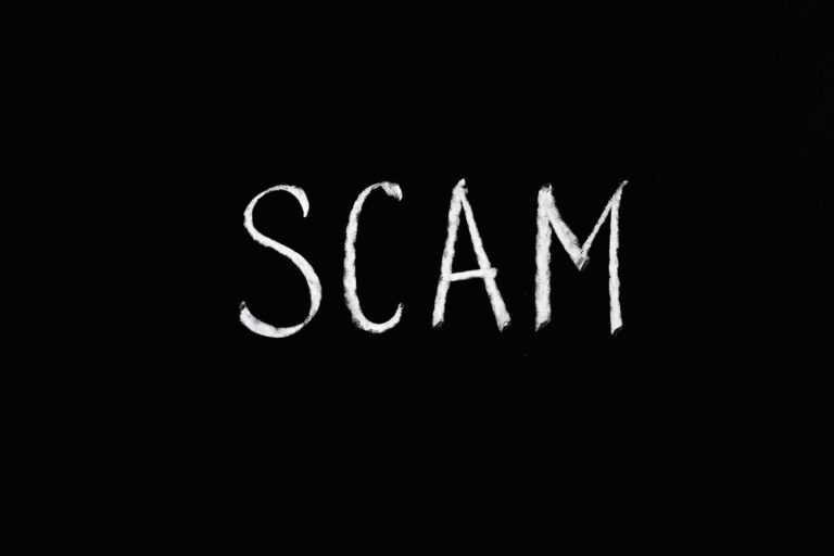 Scam written in white over black background