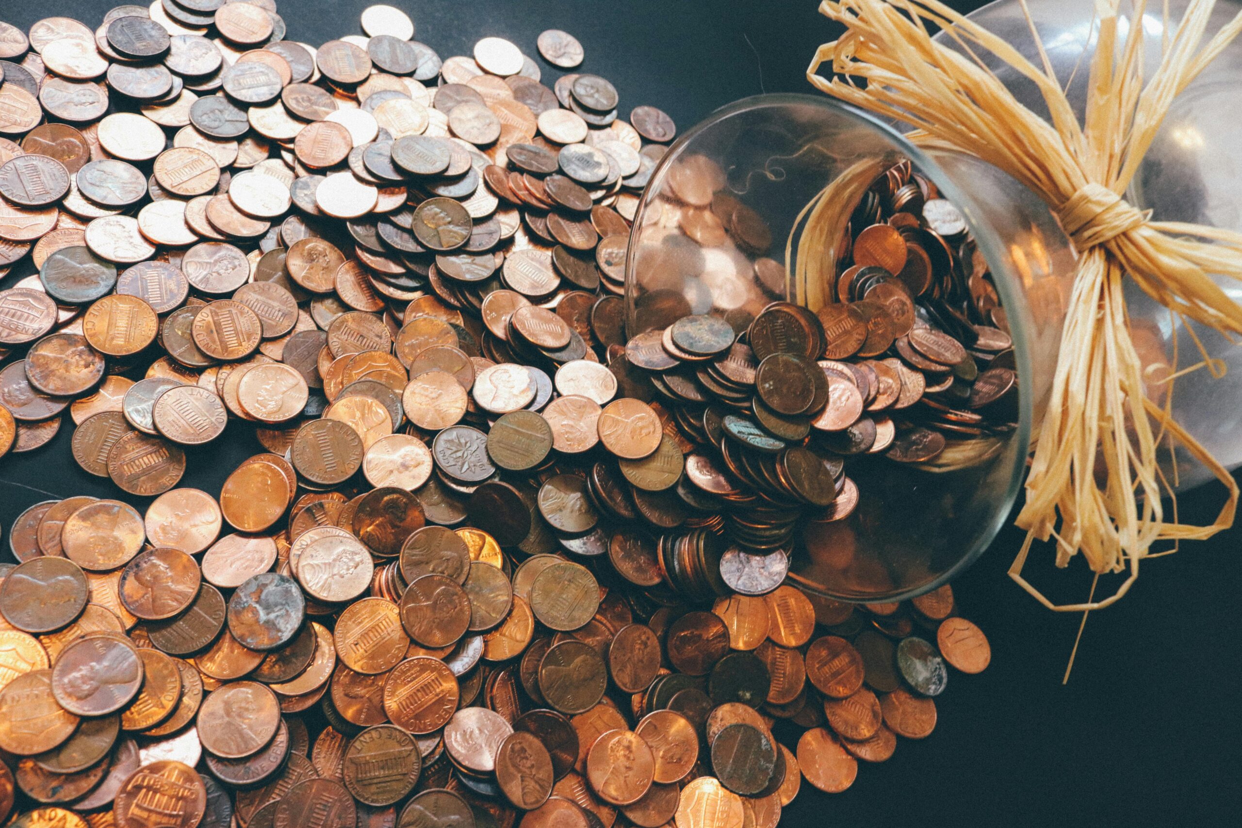 1p coins pouring out of a jar