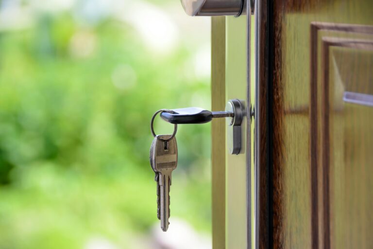 Keys inside lock of wooden door